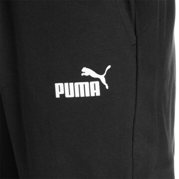 PUMA - Tapered Pantalón deportivo 'Essentials Elevated' en negro