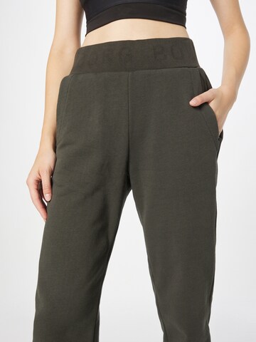 Tapered Pantaloni sportivi di BJÖRN BORG in verde