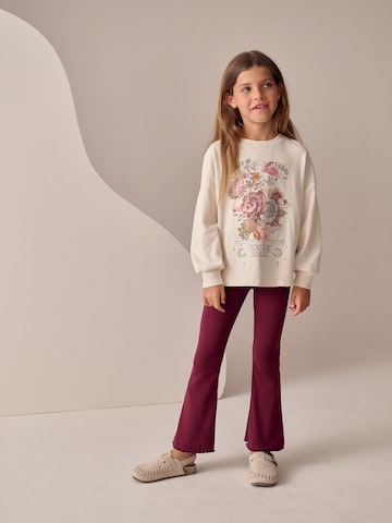 Next - Acampanado Leggings en rojo
