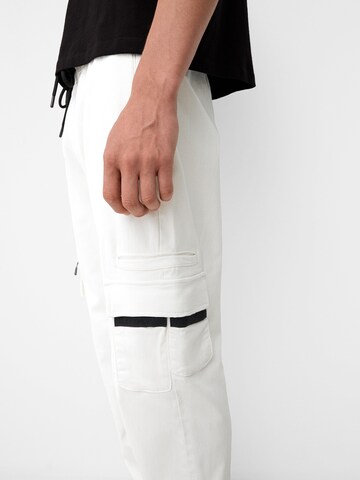 Bershka Tapered Cargo trousers in White
