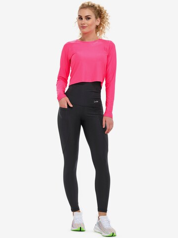 Winshape Skinny Urheiluhousut 'HWL114' värissä musta