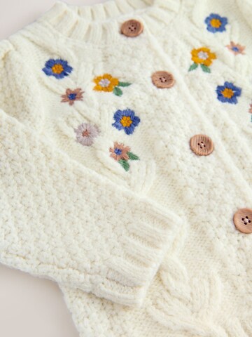 Next Neuletakki värissä beige