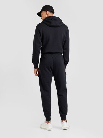 Nike Sportswear Zwężany krój Bojówki 'AIR' w kolorze czarny