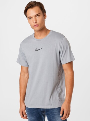 NIKE Functioneel shirt 'Burnout' in Grijs: voorkant