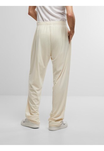 Loosefit Pantalon de sport ' ' Karl Kani en beige