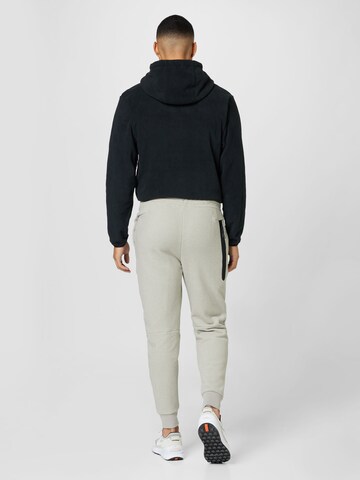 Tapered Pantaloni de la Nike Sportswear pe bej