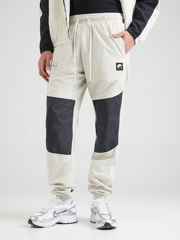 pelēks Nike Sportswear Pakapēniski sašaurināts piegriezums Bikses 'AIR': no priekšpuses