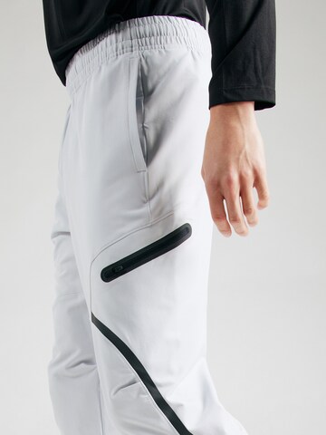 UNDER ARMOUR Tapered Sports trousers 'Unstoppable' in Grey