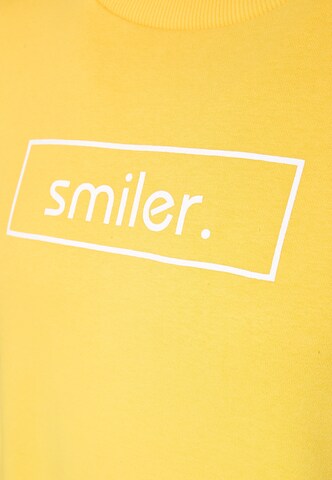 Pull-over 'Cuddle' smiler. en jaune