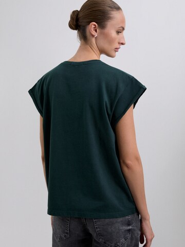 Maglietta di Scalpers in verde