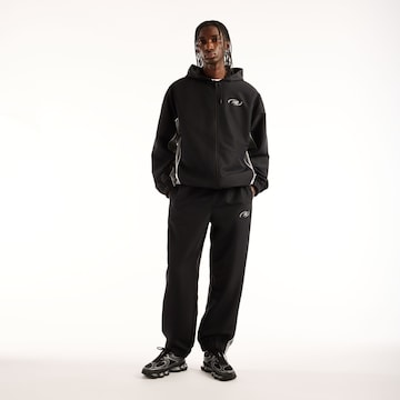 new balance - Tapered Pantalón en negro