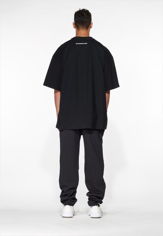 MJ Gonzales T-Shirt 'Dollar x Huge' in Schwarz