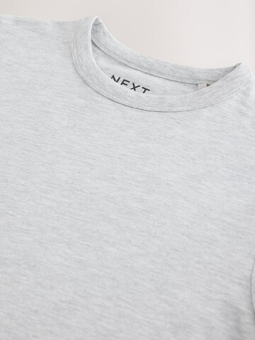 Tricou de la Next pe gri