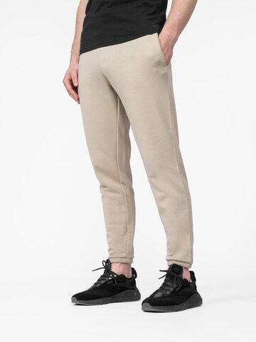 Largi Pantaloni sport de la 4F pe bej: față