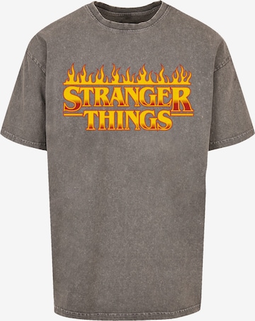 F4NT4STIC T-Shirt 'Stranger Things Fire Logo Women Netflix TV Series' in Grau: Vorderseite