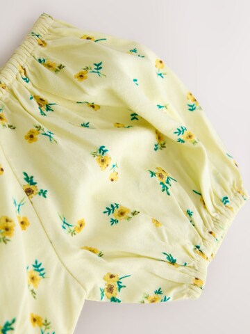 Next Mekko värissä keltainen