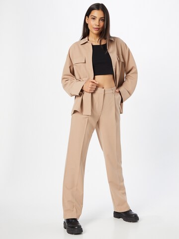 LENI KLUM x ABOUT YOU Loose fit Trousers with creases 'Eva' in Beige