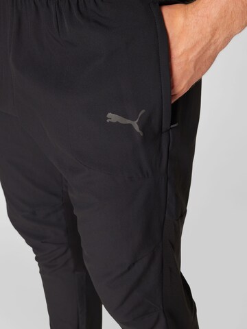 PUMA - Tapered Pantalón deportivo 'Ultraweave' en negro