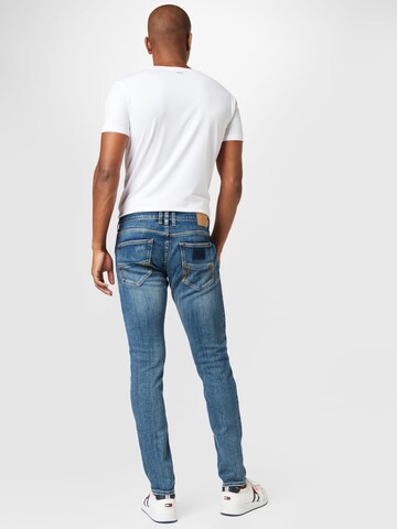 Coupe slim Jean Herrlicher en bleu