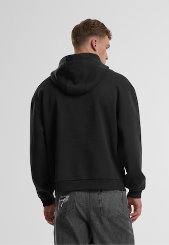 Urban Classics - Sudadera 'Fluffy' en negro