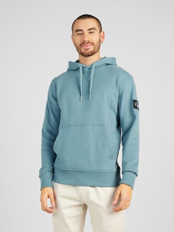 Sweat-shirt Calvin Klein Jeans en bleu : devant