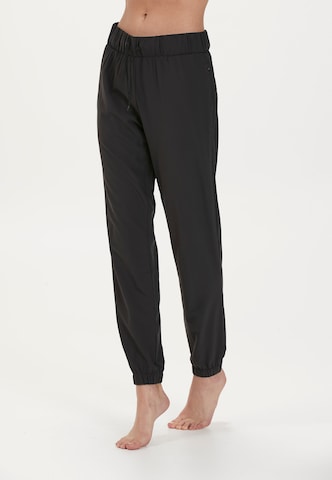 Athlecia - Tapered Pantalón deportivo 'Austberg' en negro: frente