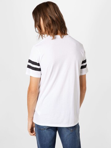 T-Shirt fonctionnel 'Originators Lockertag' UNDER ARMOUR en blanc