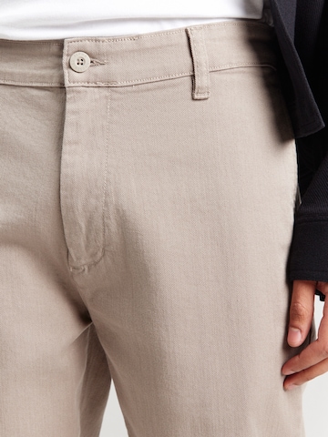 regular Pantaloni chino di ALPHA INDUSTRIES in beige