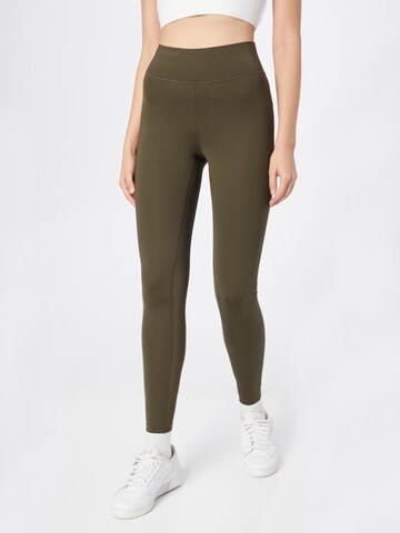 Casall Skinny Workout Pants in Green: front