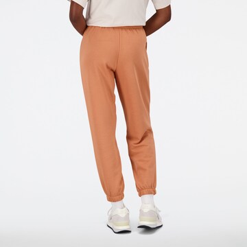 new balance Tapered Workout Pants in Orange
