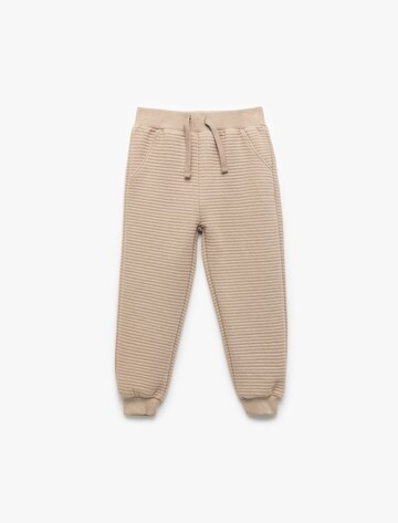 Koton Tapered Trousers in Beige: front