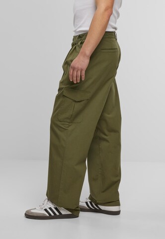 Wide leg Pantaloni cu buzunare de la Urban Classics pe verde