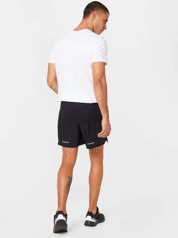 Regular Pantalon de sport 'ROAD' ASICS en noir