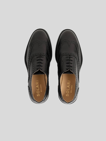 Scarpa stringata 'Brogue' di Solari Milano in nero
