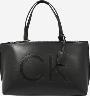 Plase de cumpărături de la Calvin Klein pe negru: față