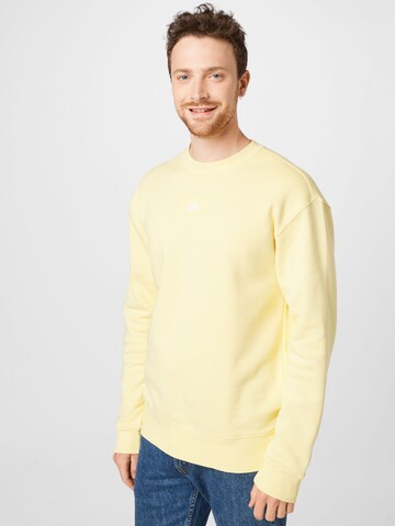 ADIDAS SPORTSWEAR Sports sweatshirt 'Essentials Feelvivid  Fleece Drop Shoulder' in Yellow: front