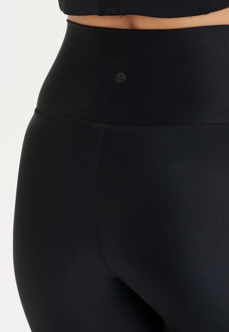 Athlecia Skinny Workout Pants 'Cadidell' in Black