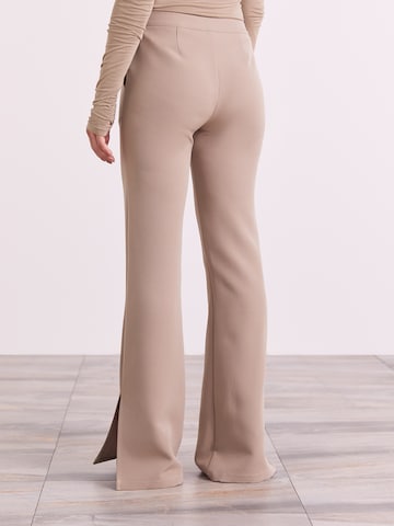 ABOUT YOU x Iconic by Tatiana Kucharova Flared Broek 'Edina' in Beige