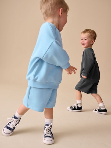 Next Träningsoverall i blå