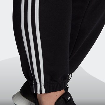 ADIDAS SPORTSWEAR Zwężany krój Spodnie sportowe 'Essentials  3-Stripes ' w kolorze czarny