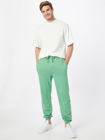 ABOUT YOU Limited Loose fit Pants 'Marlon' in Green