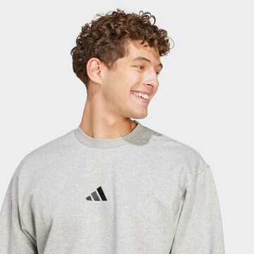 ADIDAS SPORTSWEAR - Camiseta deportiva 'FEELCOZY' en gris