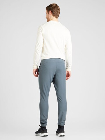 UNDER ARMOUR Tapered Sportbyxa i grå