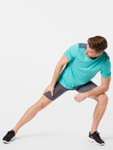 NIKE Skinny Sporthose in Grau