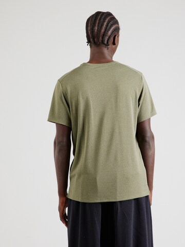 Tricou funcțional 'MILER' de la NIKE pe verde