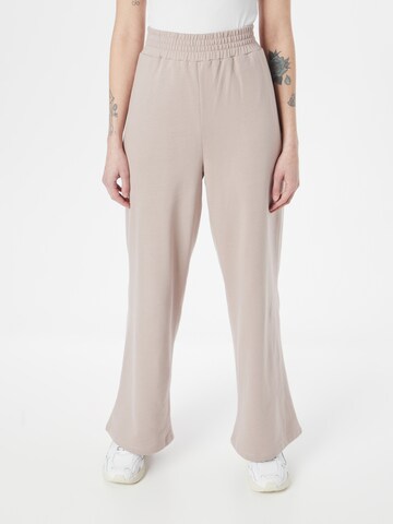 ABOUT YOU Wide leg Trousers 'Lucky' in Beige: front