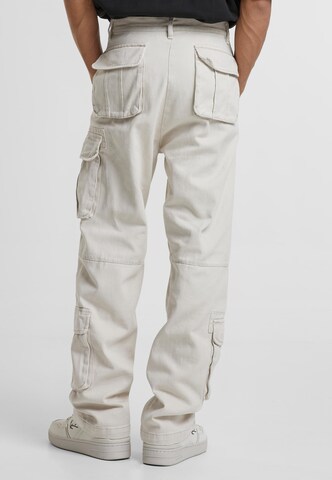 Karl Kani Regular Cargo trousers in Beige