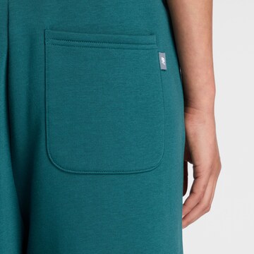 Baggy Pantalon de sport 'Trackside Fleece Barrel Pant' new balance en vert