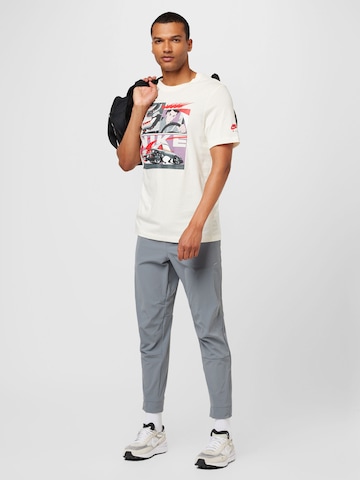 Effilé Pantalon de sport 'UNLIMITED' NIKE en gris