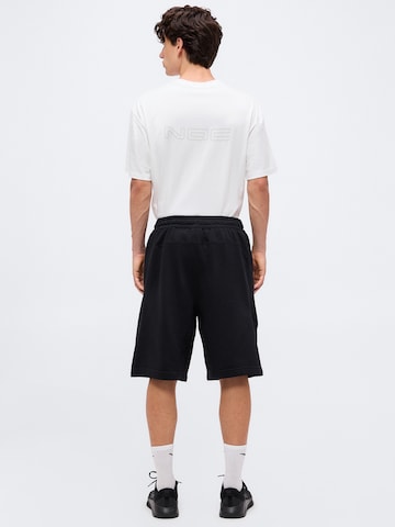 NIKE Loosefit Παντελόνι φόρμας 'NAC FLC' σε μαύρο